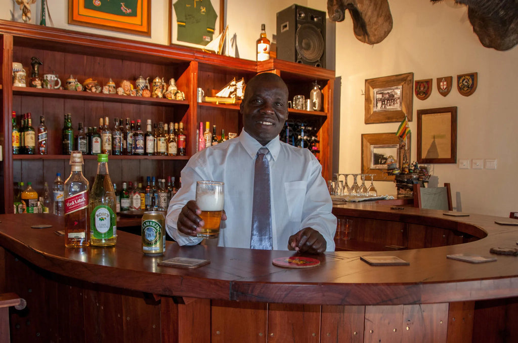 Barman Charles welcomes you to the Bayete Bar at Bayete Guest Lodge, Victoria Falls (Zimbabwe), Zimbabwe.