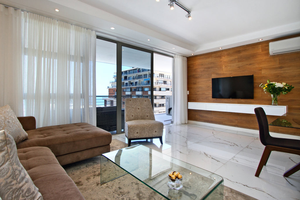 Open plan living area leading onto balcony