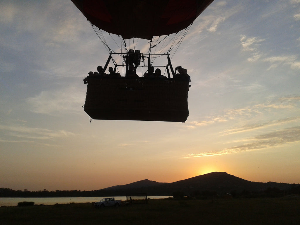 Beautiful silhouette of the balloon as it takes to the skies at sunrise