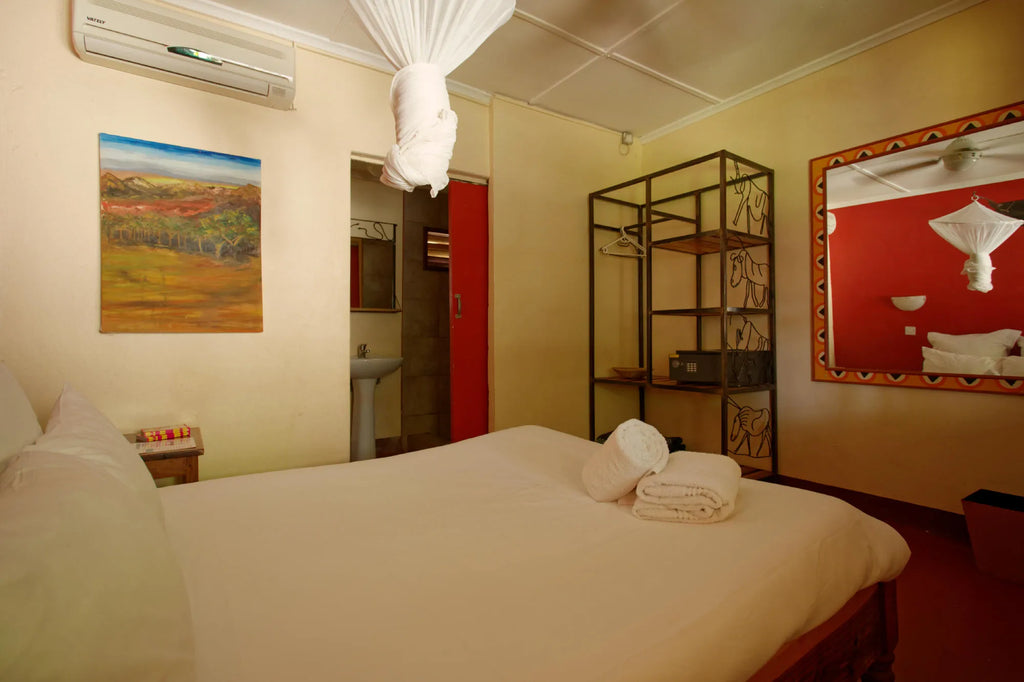 Ensuite double room with air conditioning at Jollyboys Backpackers & Camp, Livingstone, Zambia.