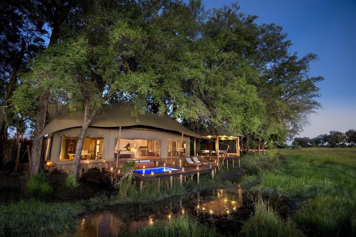 Duba Plains Guest Suite Evening Exterior View at Duba Plains Camp, Duba Plains Private Reserve, Botswana.