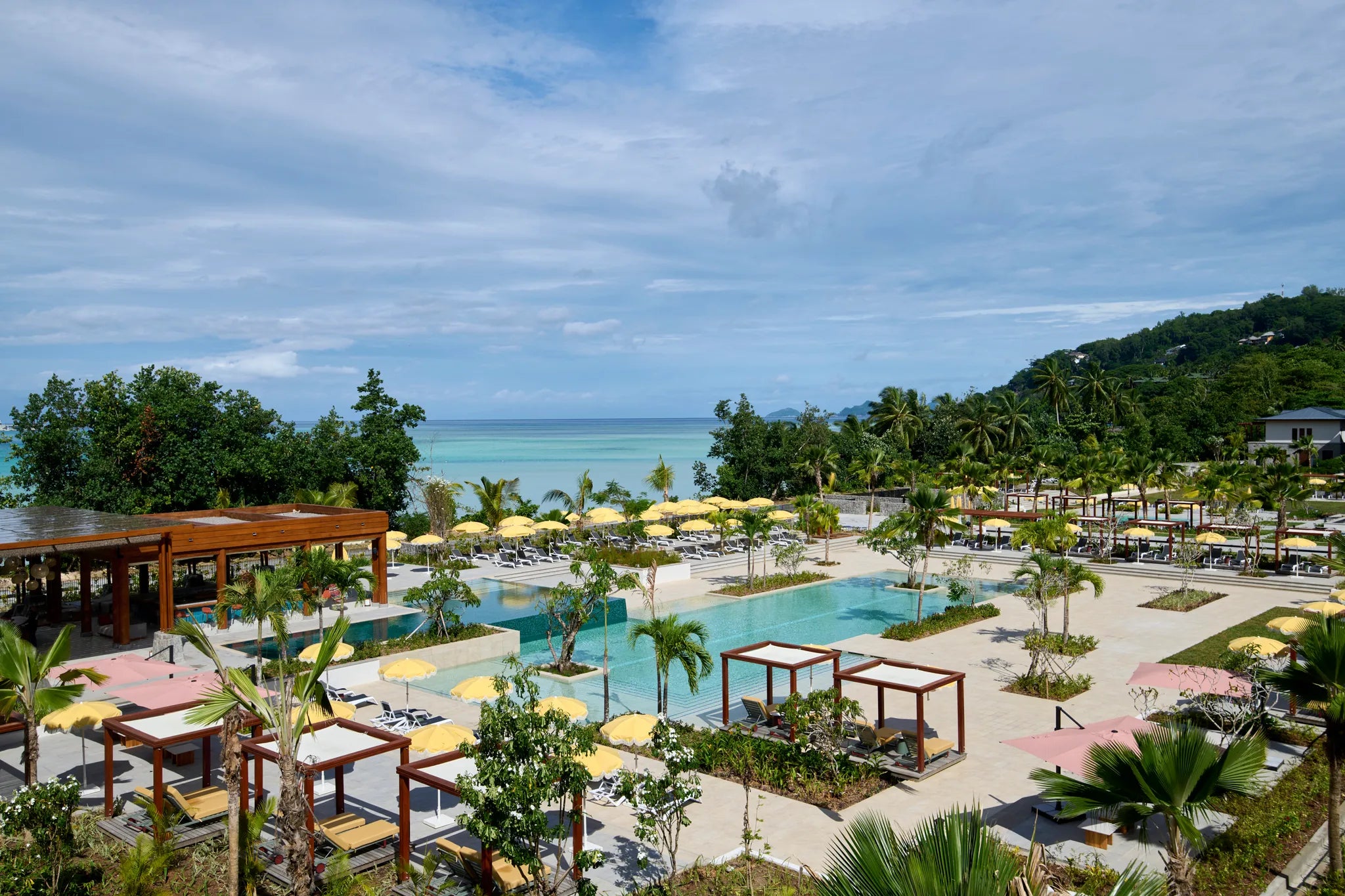 Sega Bar, swimming pool, promenade and beach at Canopy by Hilton Seychelles Resort, Mahe Island, Seychelles.