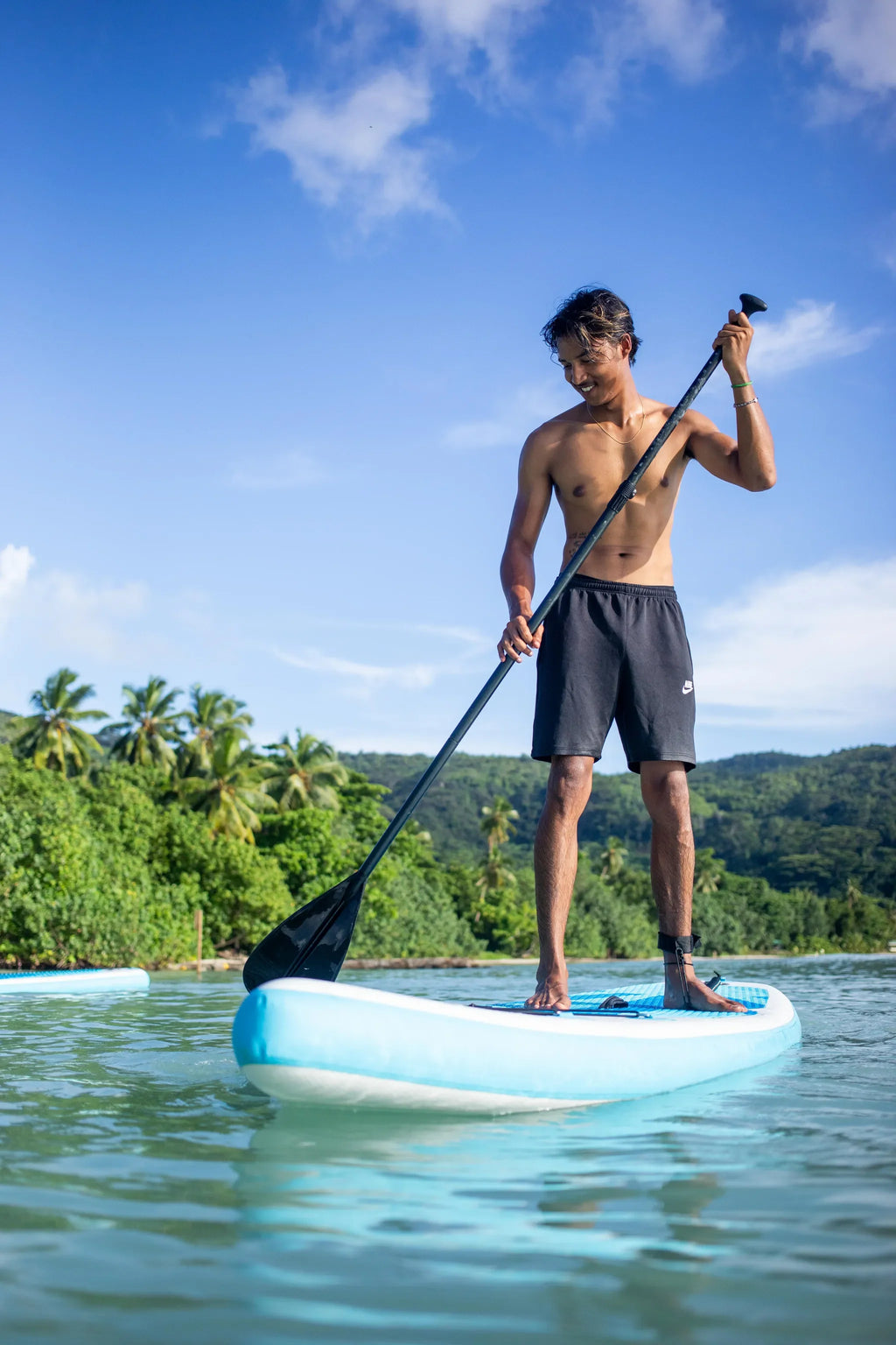 Stand up paddle at Canopy by Hilton Seychelles Resort, Mahe Island, Seychelles.