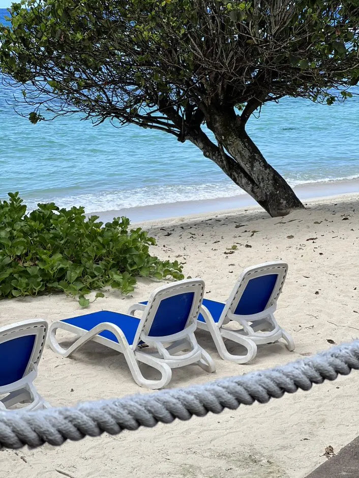 Beach at DoubleTree by Hilton Seychelles Allamanda Resort and Spa, Mahe Island, Seychelles.