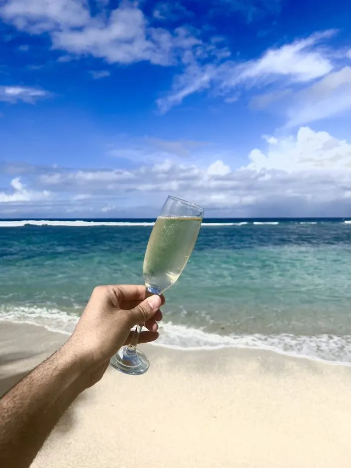 Bubbly by the shore at DoubleTree by Hilton Seychelles Allamanda Resort and Spa, Mahe Island, Seychelles.