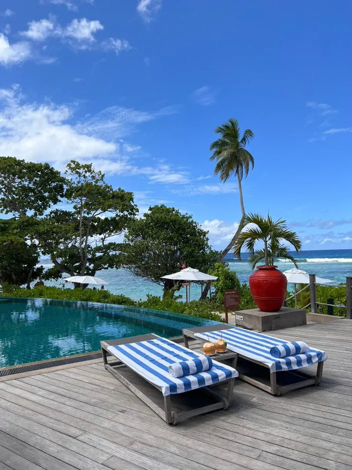 Pool side at DoubleTree by Hilton Seychelles Allamanda Resort and Spa, Mahe Island, Seychelles.