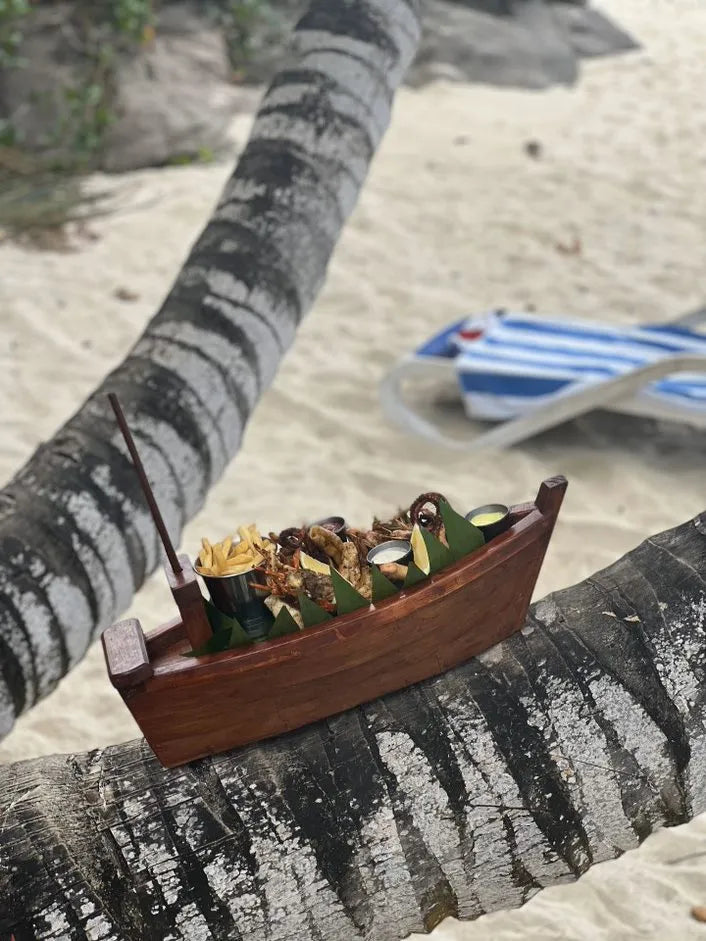 Sea food served Boat style at DoubleTree by Hilton Seychelles Allamanda Resort and Spa, Mahe Island, Seychelles.