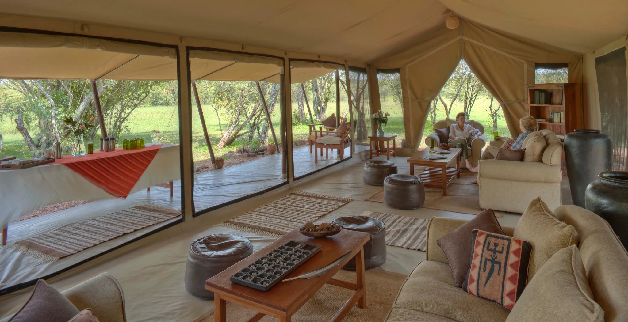 Asilia Africa | Encounter Mara - Guest lounge and patio at Encounter Mara, Mara Naboisho Conservancy, Kenya.