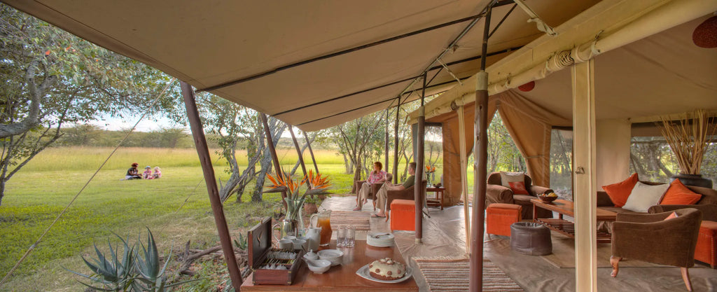 Asilia Africa | Encounter Mara - Guest patio area at Encounter Mara, Mara Naboisho Conservancy, Kenya.