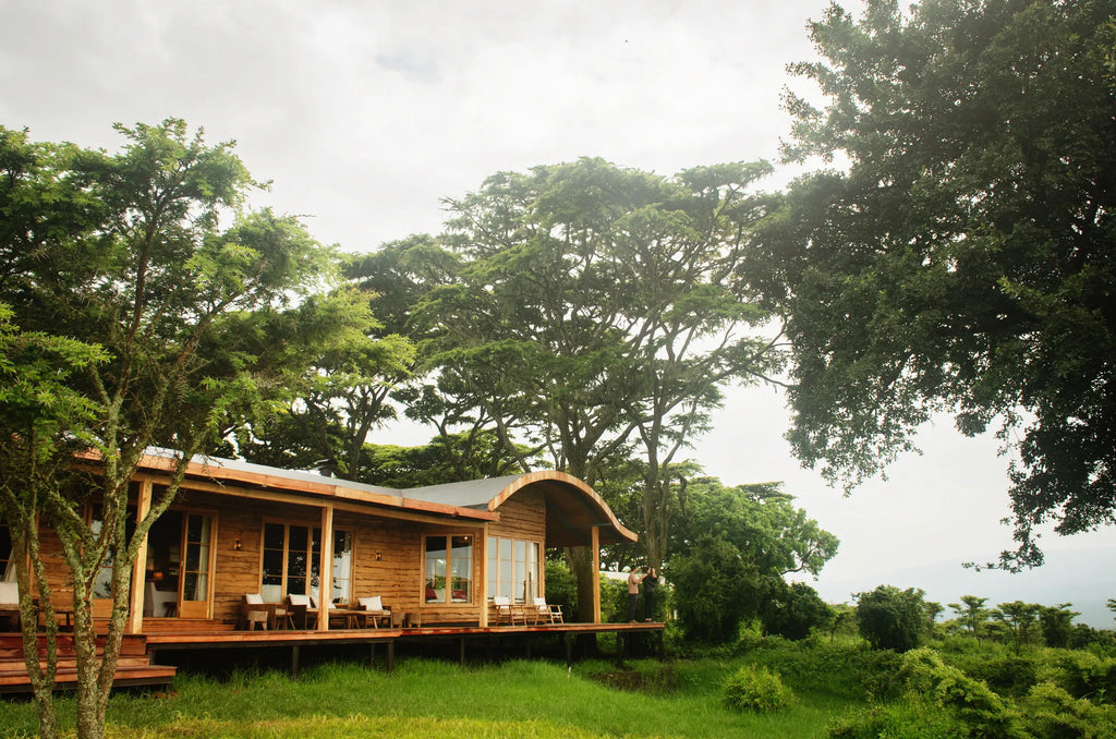 Guests enjoy the morning view from the Entamanu mess at Entamanu Ngorongoro, Ngorongoro Crater, Tanzania.