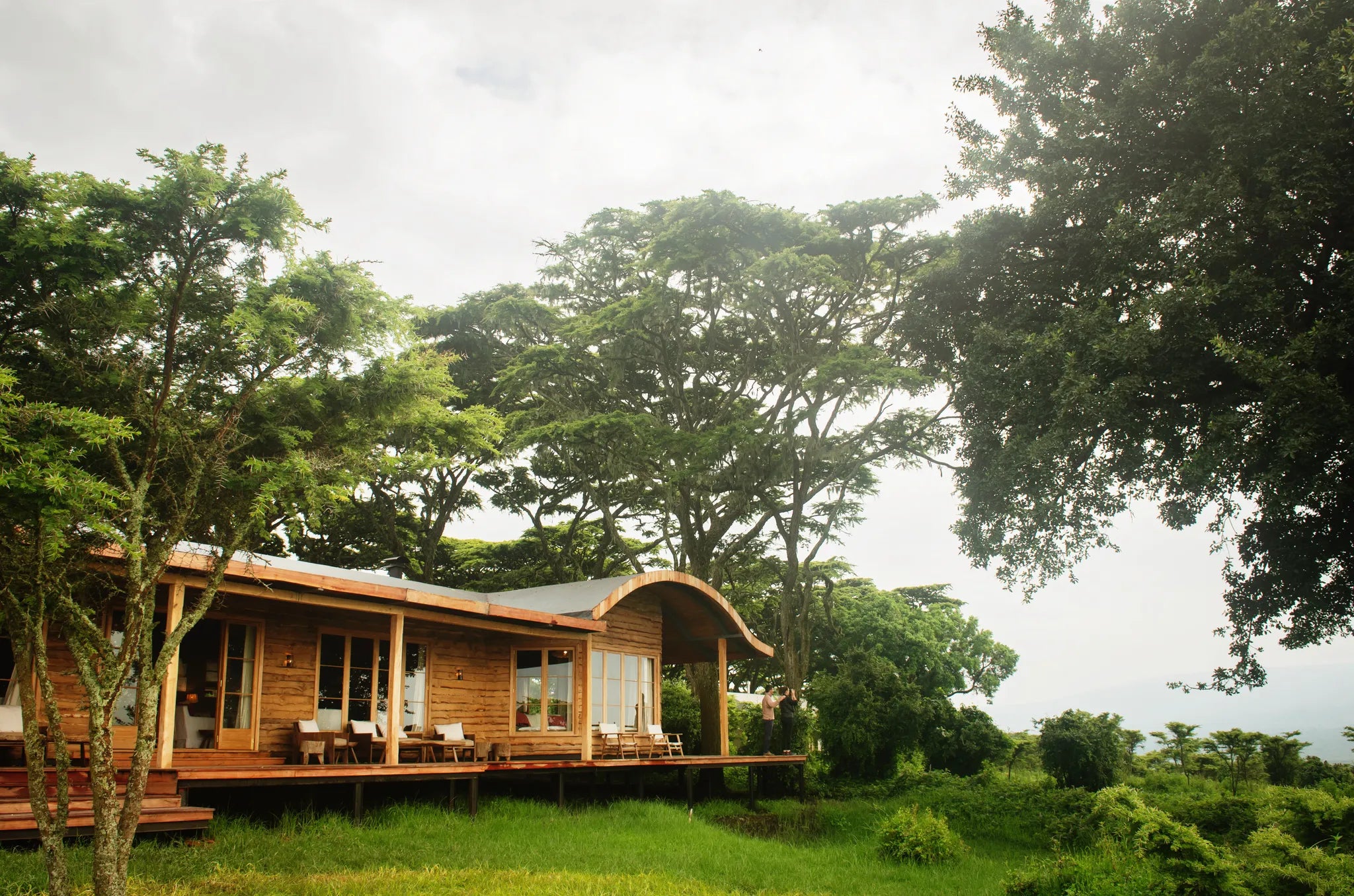 Guests enjoy the morning view from the Entamanu mess at Entamanu Ngorongoro, Ngorongoro Crater, Tanzania.