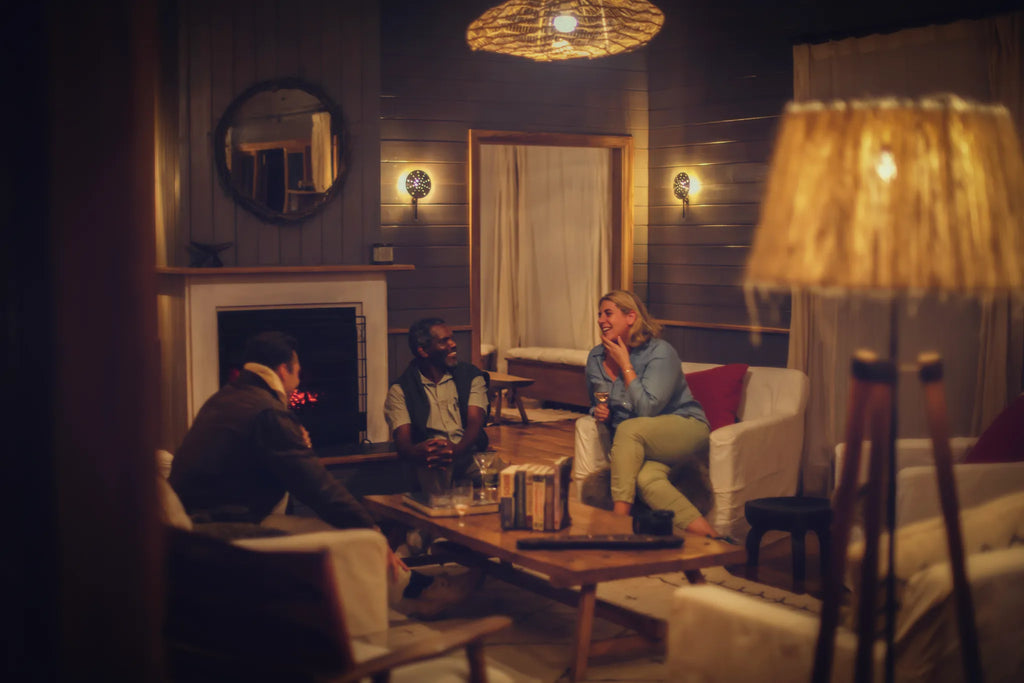 Perfect evening with guests chatting in the Entamanu mess at Entamanu Ngorongoro, Ngorongoro Crater, Tanzania.