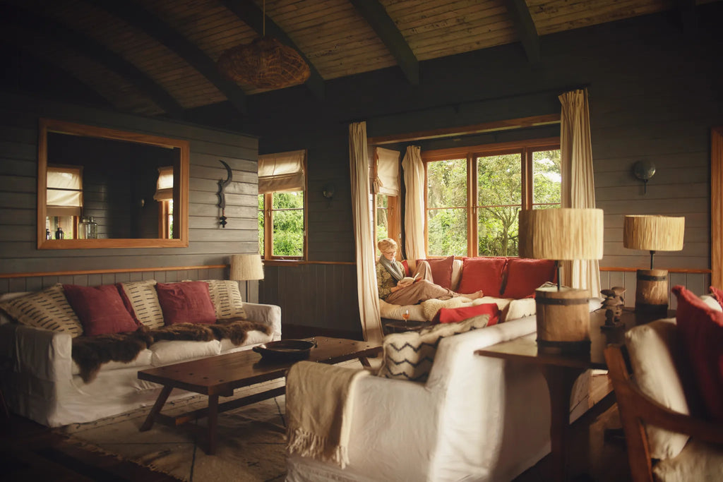 Relaxing in the afternoon in one of the sitting rooms at Entamanu at Entamanu Ngorongoro, Ngorongoro Crater, Tanzania.