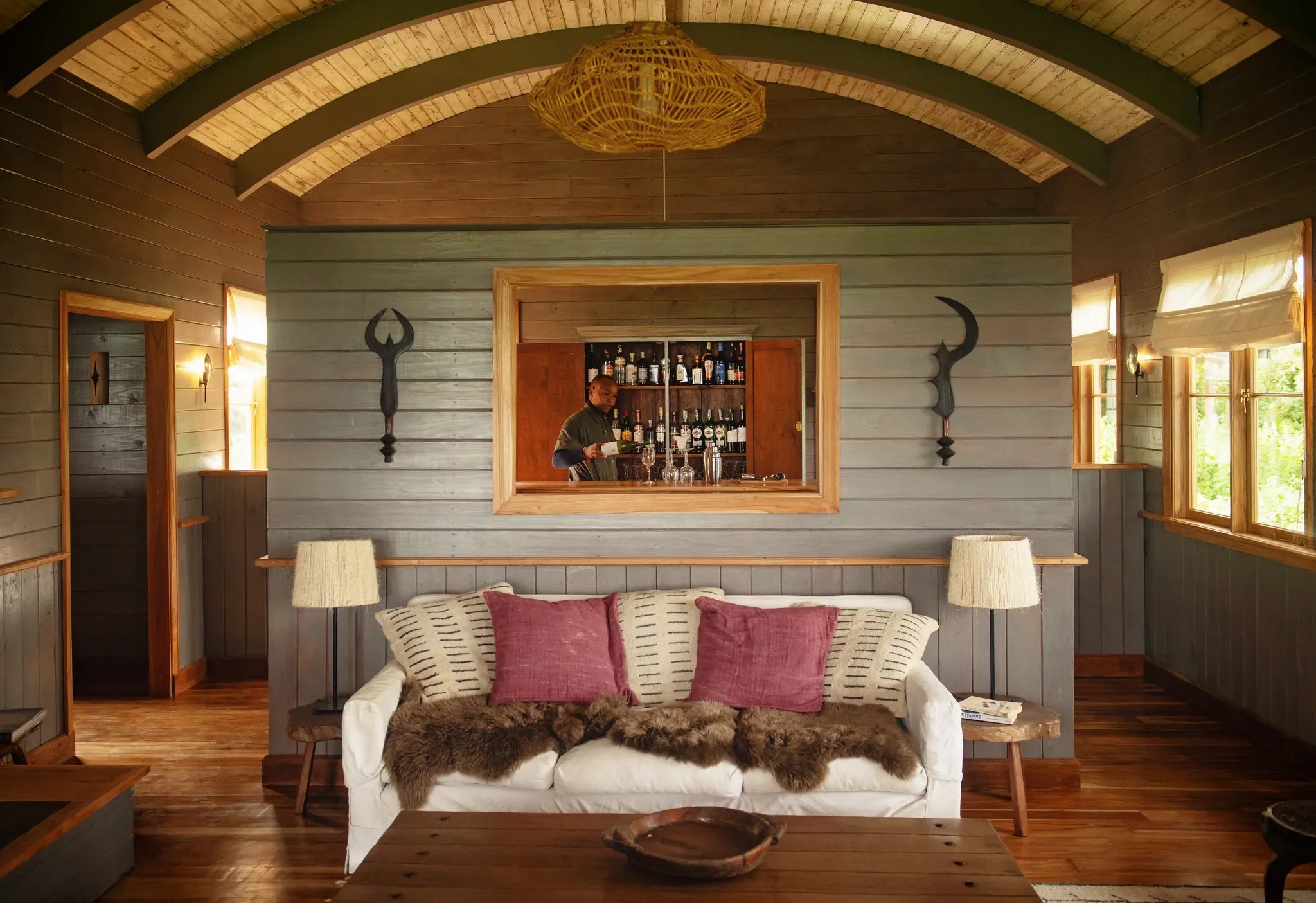 Sundowners are poured in the bar at Entamanu at Entamanu Ngorongoro, Ngorongoro Crater, Tanzania.