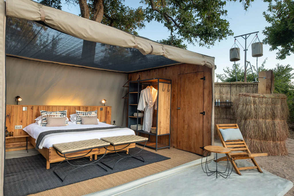 Kokoko - Tent Exterior with Outdoor Shower at Kokoko Camp, Ruaha National Park, Tanzania.
