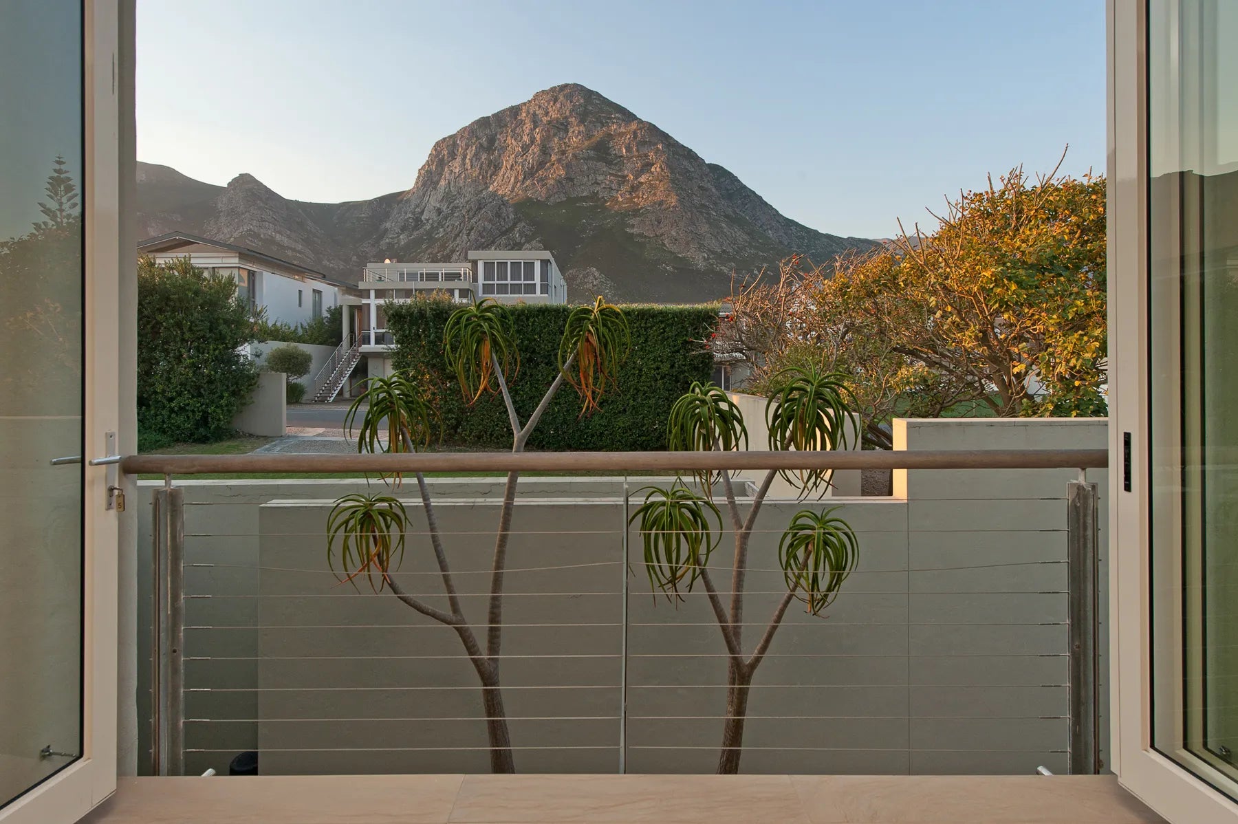 Olive deluxe room at Mosselberg on Grotto Beach, Hermanus, South Africa.