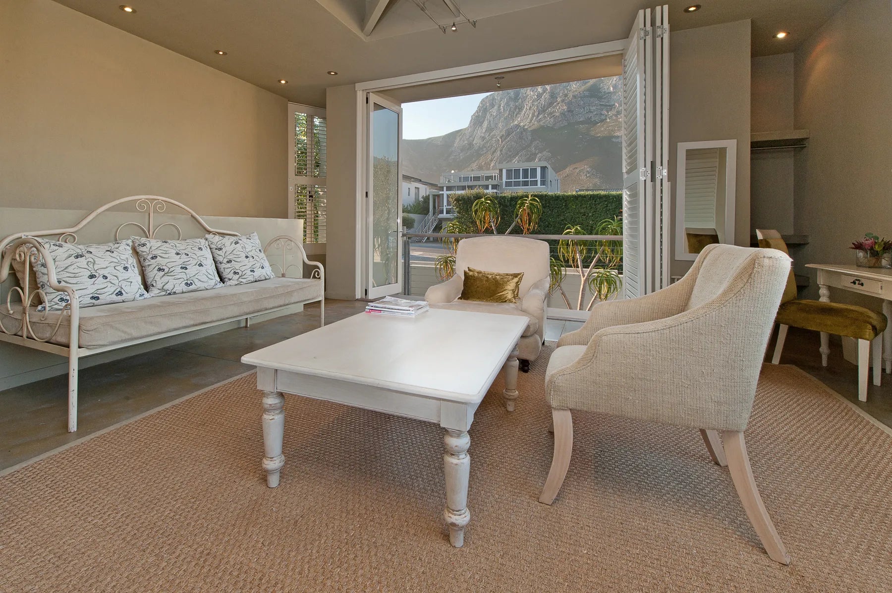 Olive deluxe room at Mosselberg on Grotto Beach, Hermanus, South Africa.