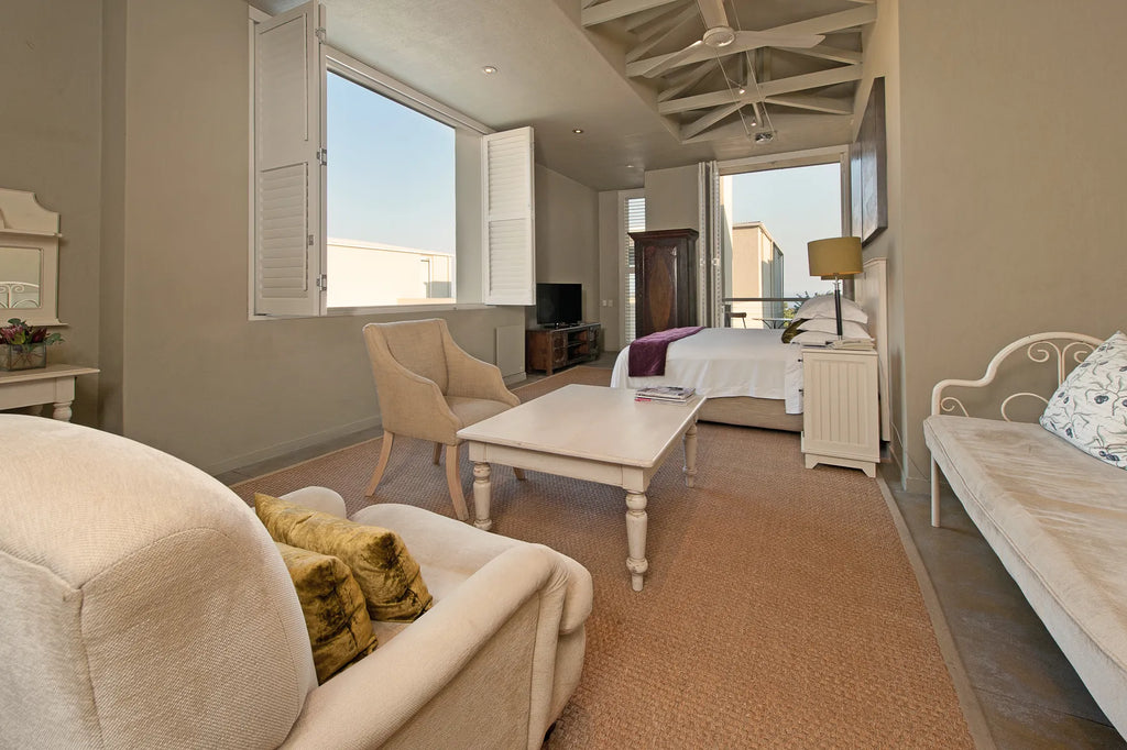 Olive deluxe room at Mosselberg on Grotto Beach, Hermanus, South Africa.