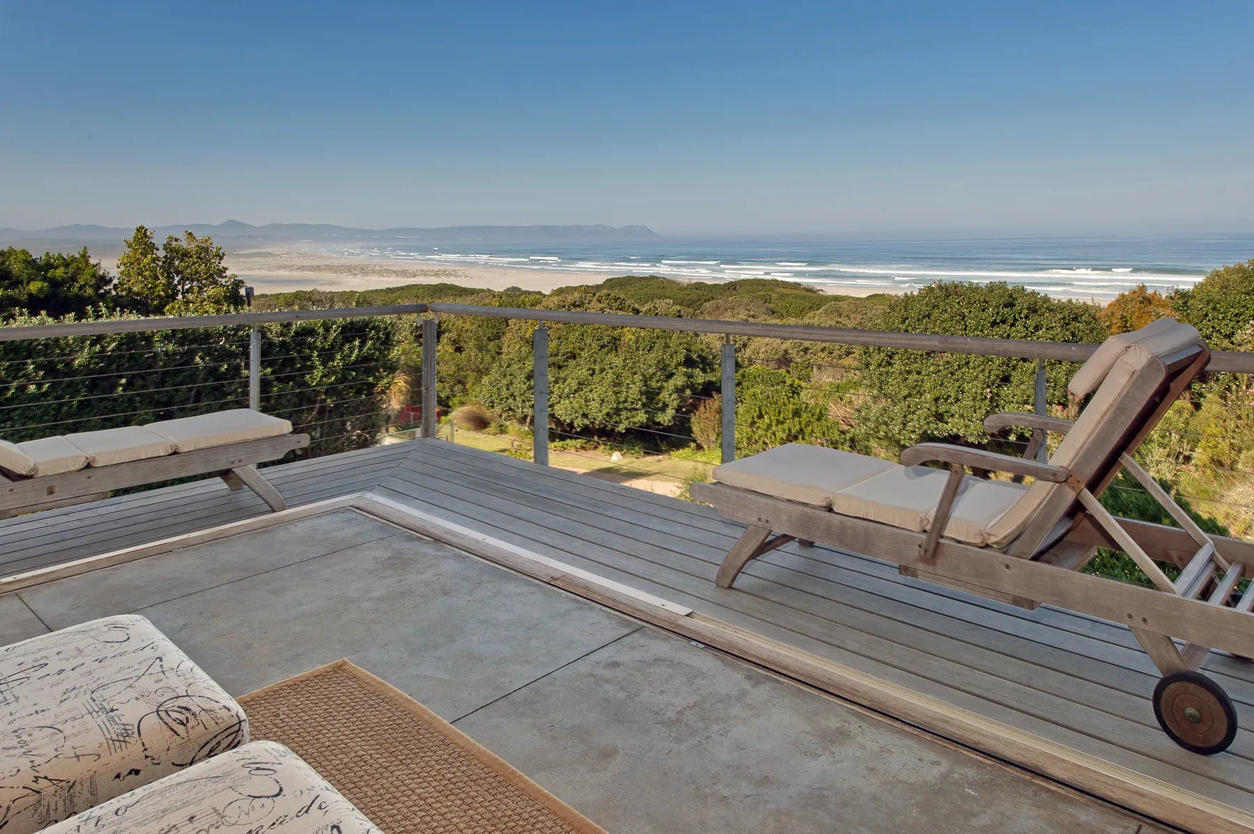 Sea facing deck at Mosselberg on Grotto Beach, Hermanus, South Africa.
