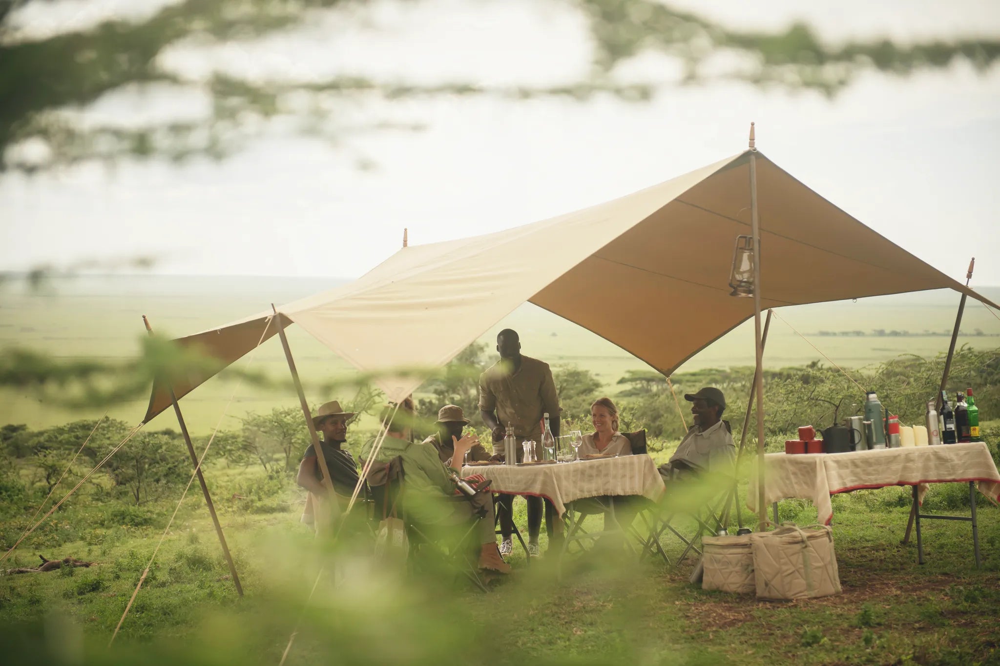 Communal dining in the shade (Serengeti pictured) at Nomad Tanzania Expeditionary Walking Camp [Jul-Oct] , Ruaha National ...