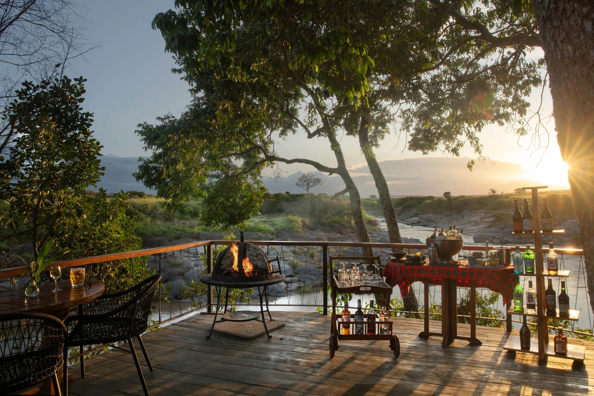 Rekero Camp - Sundowners on the Deck at Rekero, Masai Mara National Reserve, Kenya.