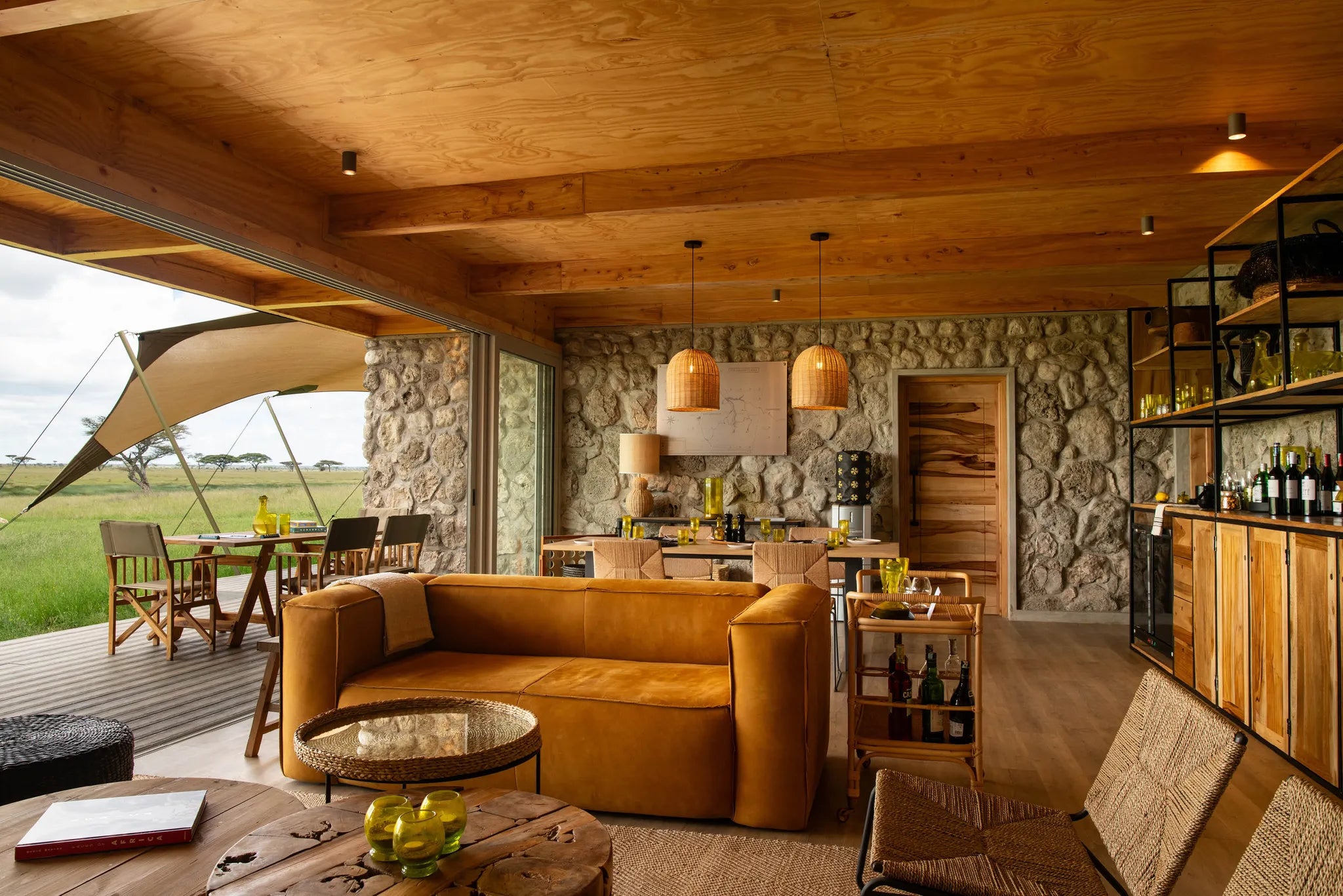 Asilia Africa - Namiri Plains Retreats - Living Room Interior & deck at Retreats at Namiri Plains, Eastern Serengeti.