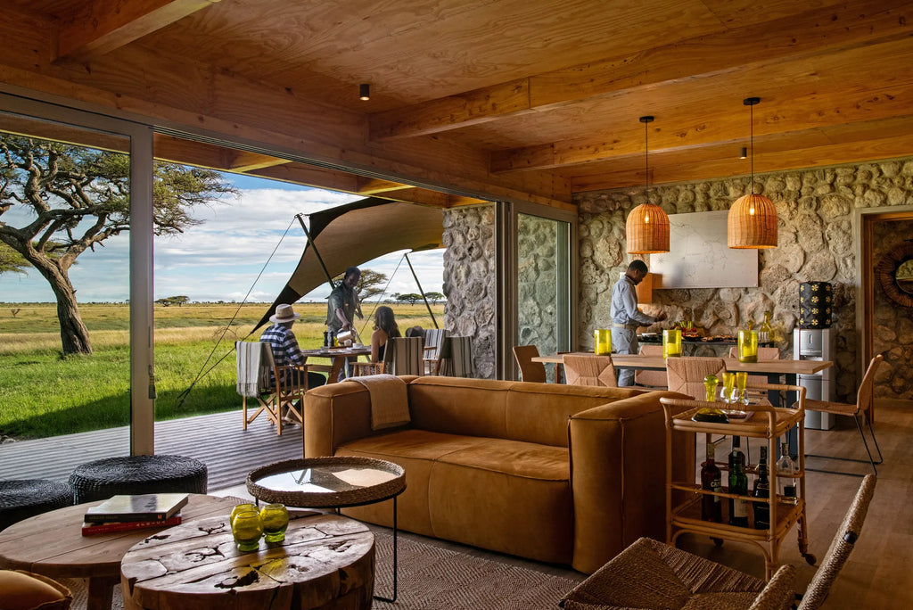 Asilia Africa - Namiri Plains Retreats - Guests dining on the deck at Retreats at Namiri Plains, Eastern Serengeti.