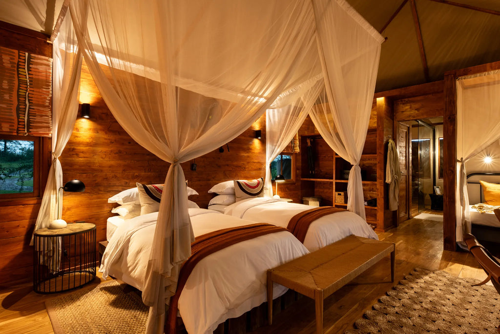 Asilia Africa - Sayari Retreat - Twin Room Interior Evening at Retreats at Sayari, Northern Serengeti, Tanzania.