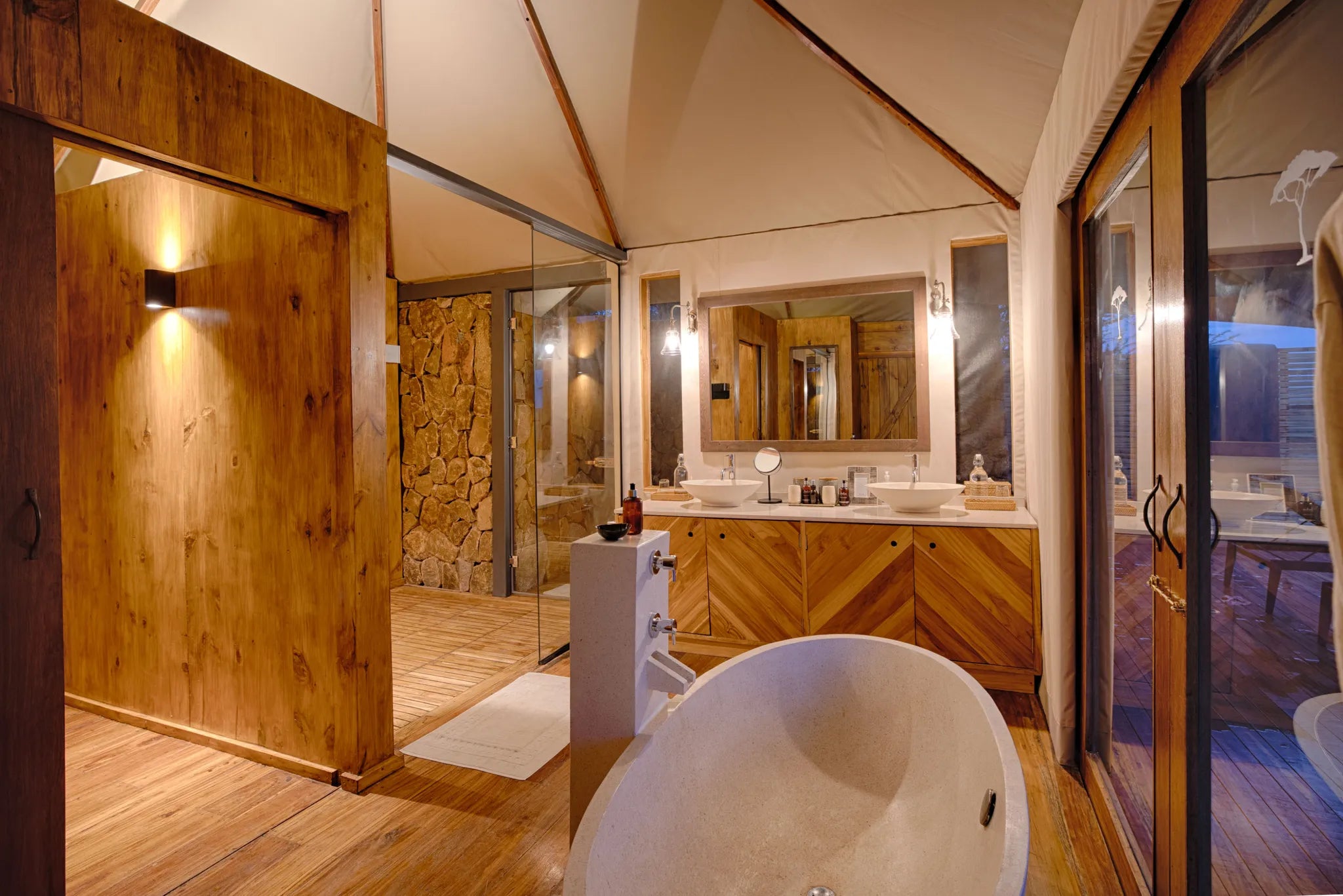 Sayari - huge bath with walk in shower at Sayari, Northern Serengeti, Tanzania.