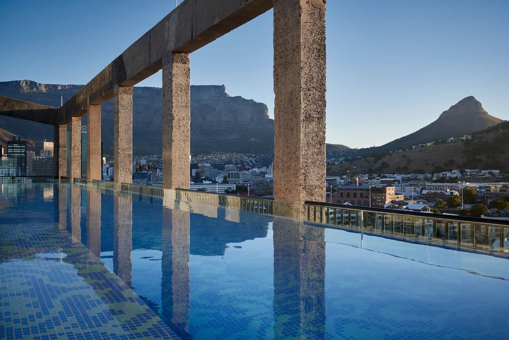 The rooftop pool offers beautiful views of Table Mountain at The Silo Hotel, Cape Town, South Africa.