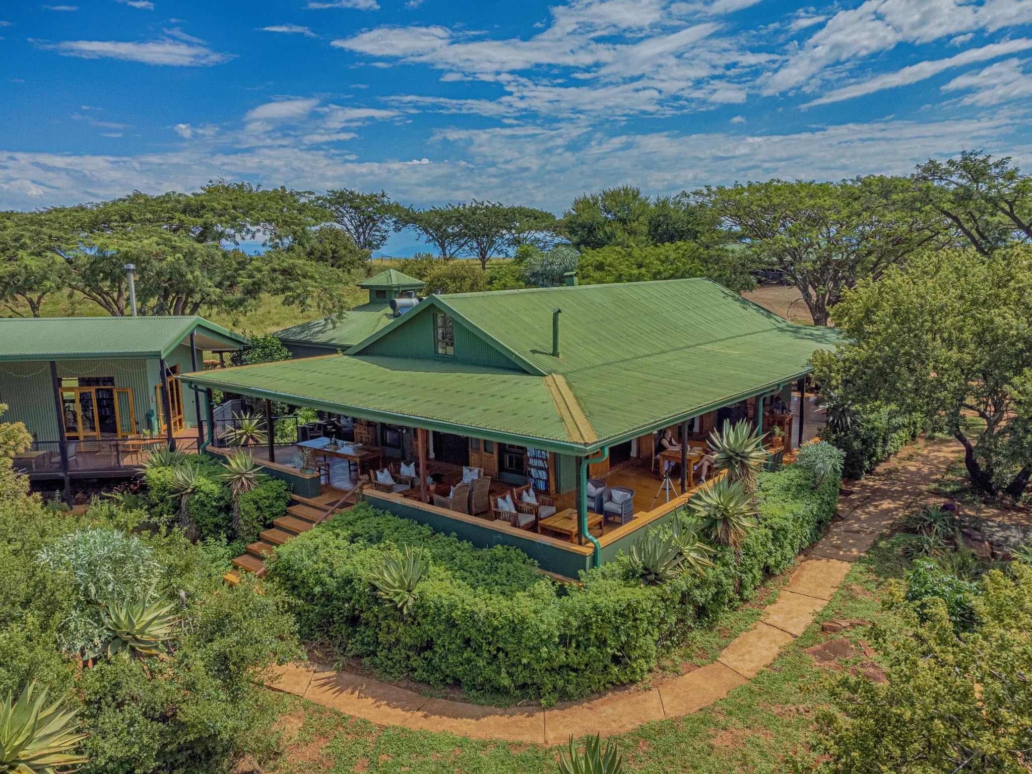 Main Lodge Lounge Verandah & Library Area at Three Tree Hill Lodge, Northern Drakensberg, South Africa.