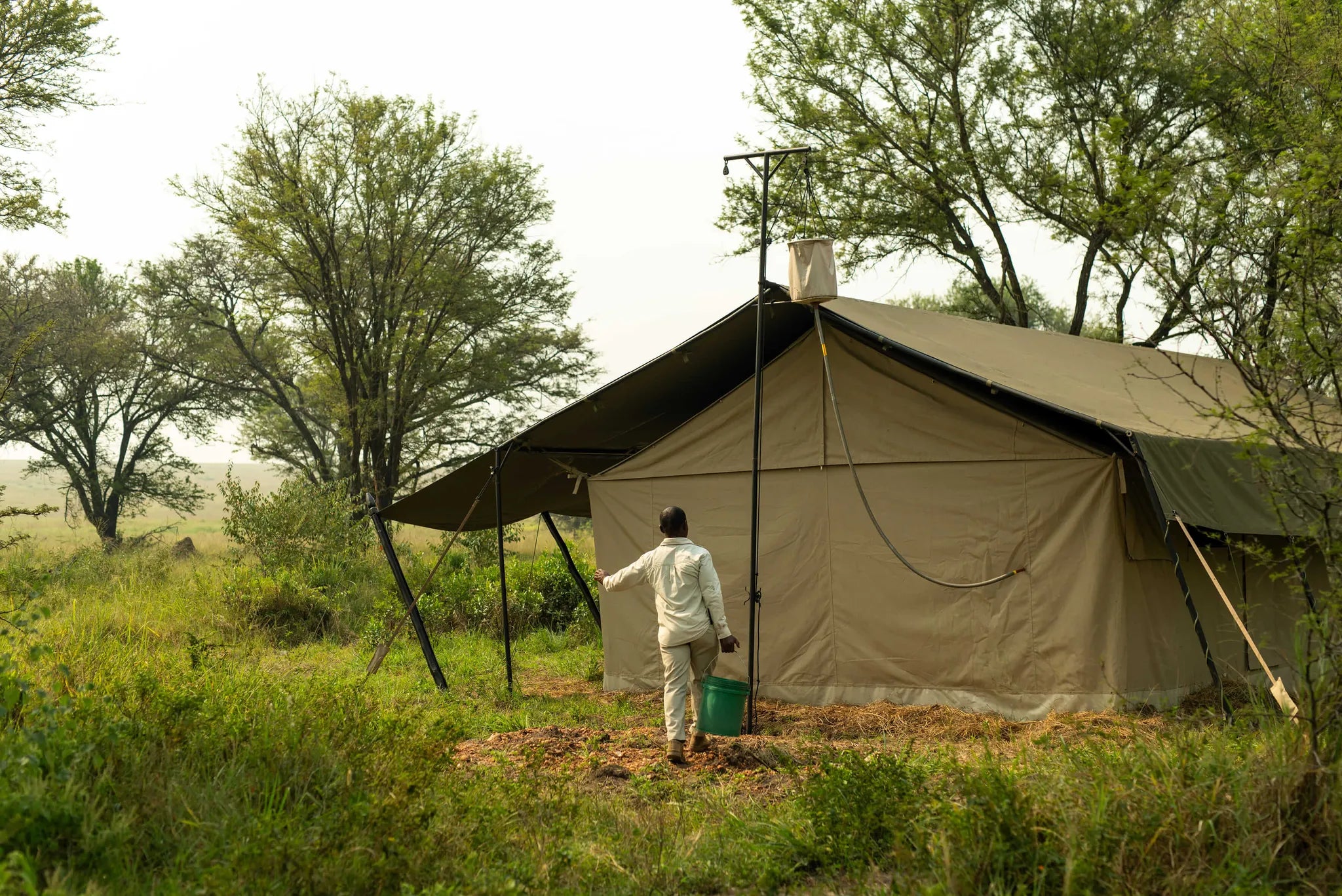 Ubuntu Camp - Bucket Shower at Ubuntu Migration Camp - South (Dec - Mar), Southern Serengeti, Tanzania.