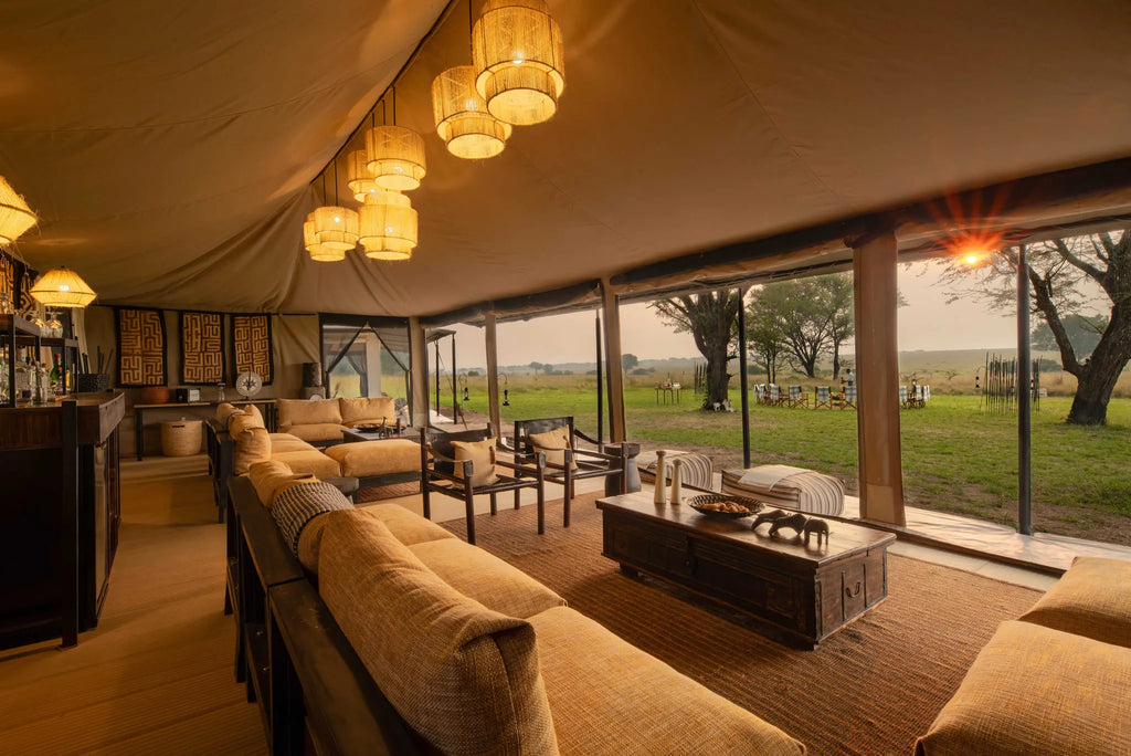 Ubuntu Camp -- Main area lit up with sun peaking in at sunset at Ubuntu Migration Camp - South (Dec - Mar), Southern Seren...