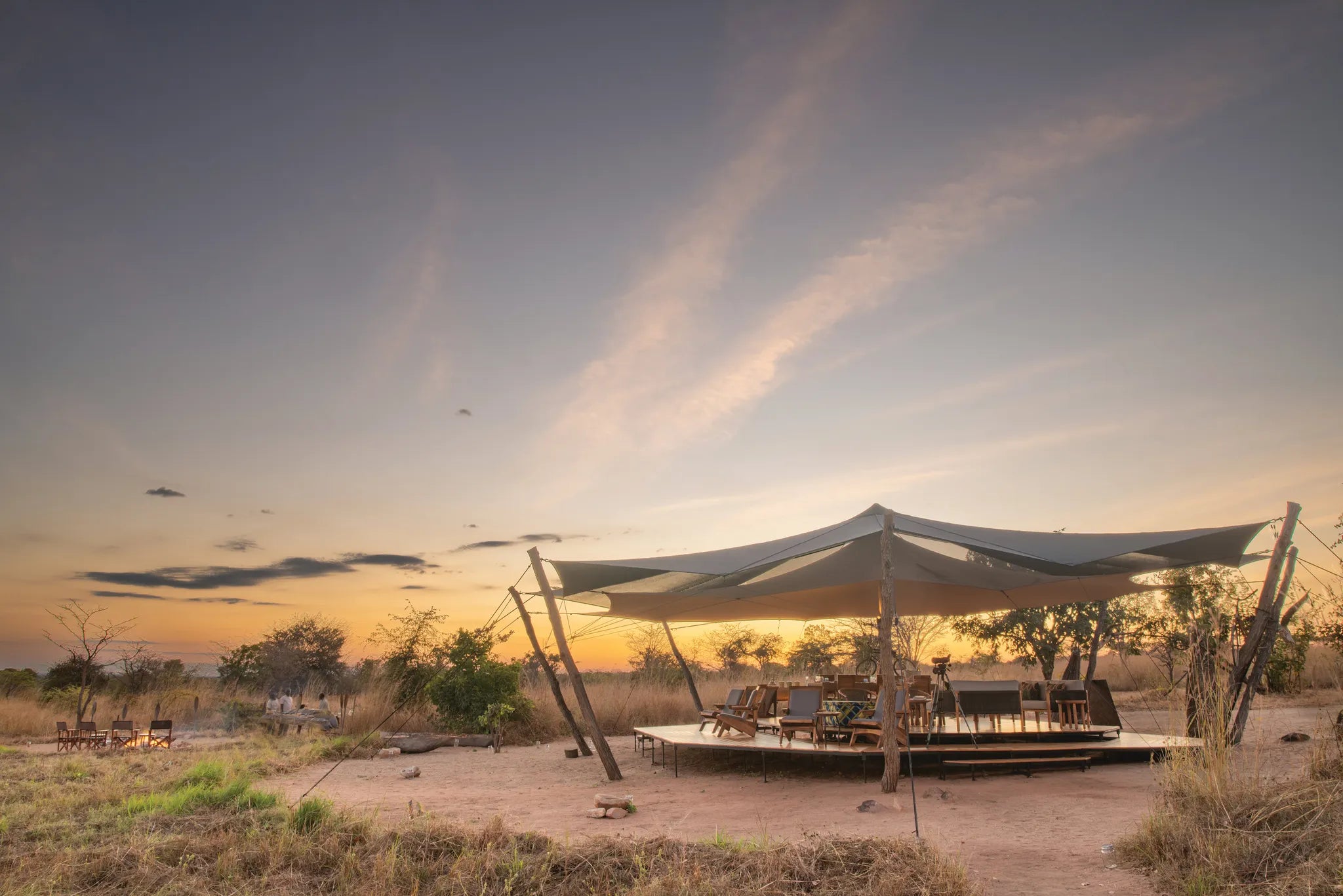 Usangu Expedition Camp - Sundowners in the Main Area at Dusk at Usangu Expedition Camp, Ruaha National Park, Tanzania.