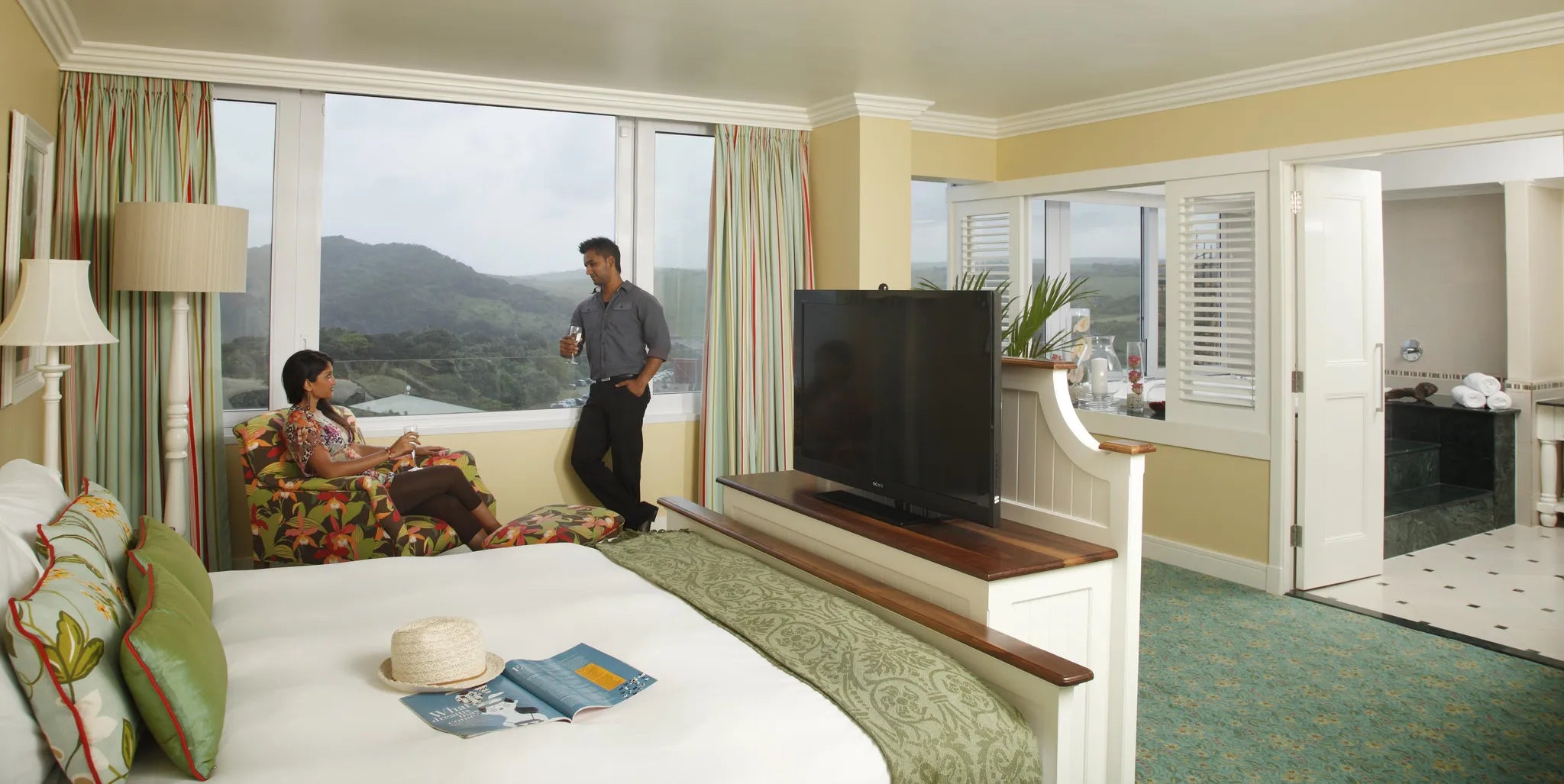 Wild Coast Sun Presidential Suite - bedroom with guests at Wild Coast Sun, The Wild Coast, South Africa.